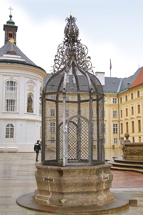 Czech Republic - Prague - Cage protecting an ancient well in a Castle courtyard