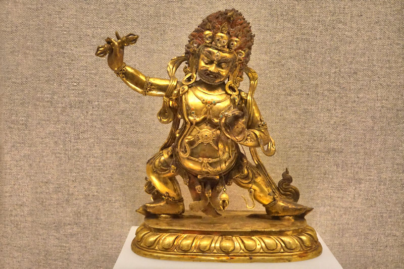 TIBETAN gilt/brass figurine of a Protector, QING
