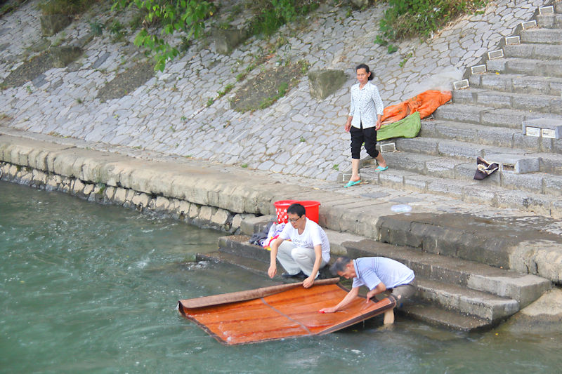 Local chores in the Li River, Guilin, China