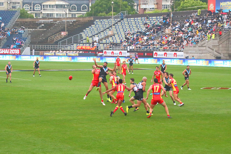 Action between the AFL teams Gold Coast and Port Adelaide