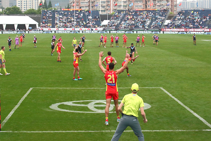 Action between the AFL teams Gold Coast and Port Adelaide at Jiangwan Stadium, Shanghai, China
