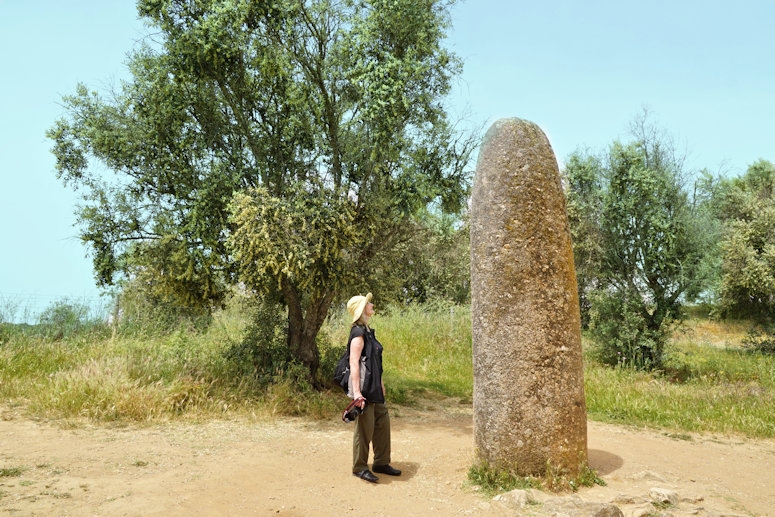 Isolated single menhir of the Almendres Cromlech standing stones, 10 km west of Evora, Portugal