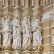 Close-up of the apostle sculptures at the main entrance to the Cathedral of Évora, Portugal