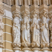 Close-up of the apostle sculptures at the main entrance to the Cathedral of Évora, Portugal