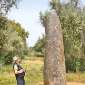 Isolated single menhir of the Almendres Cromlech standing stones, 10 km west of Evora, Portugal