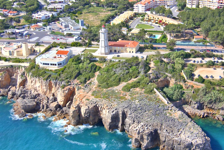 Flying almost due west along the coastline from west Lisbon, we see the coastal towns (and the cliffs) of Estoril and Cascais, before coming to the cliffs on the coast of the Sintra National Park.