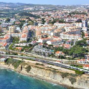 Flying almost due west along the coastline from west Lisbon, we see the coastal towns (and the cliffs) of Estoril and Cascais, before coming to the cliffs on the coast of the Sintra National Park.