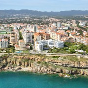 Flying almost due west along the coastline from west Lisbon, we see the coastal towns (and the cliffs) of Estoril and Cascais, before coming to the cliffs on the coast of the Sintra National Park.