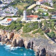 Flying almost due west along the coastline from west Lisbon, we see the coastal towns (and the cliffs) of Estoril and Cascais, before coming to the cliffs on the coast of the Sintra National Park.