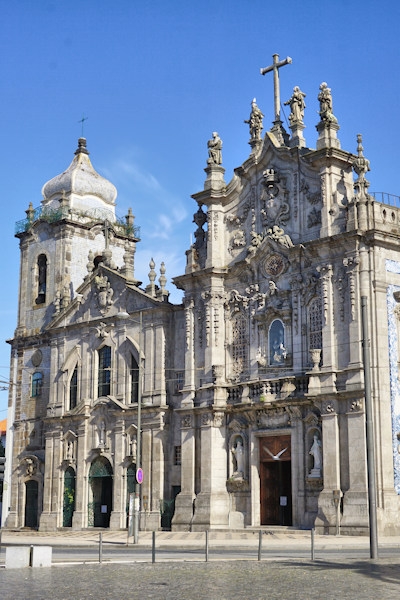 Right: 1750 Rococo Church of Carmo in Porto, Left: 1625 Baroque Church of Carmelitas, Porto