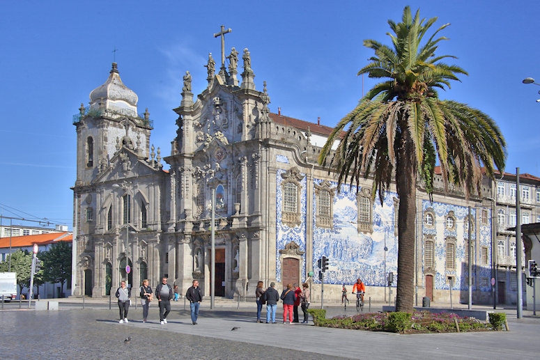 Right: 1750 Rococo Church of Carmo in Porto, Left: 1625 Baroque Church of Carmelitas, Porto