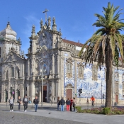 Right: 1750 Rococo Church of Carmo in Porto, Left: 1625 Baroque Church of Carmelitas, Porto