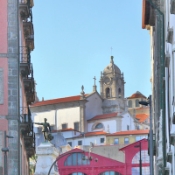 In the old town we see the Statue of Infante dom Henrique (Prince Henry the Navigator) -  in the background the Market-Hall Ferreira Borges - Porto, Portugal